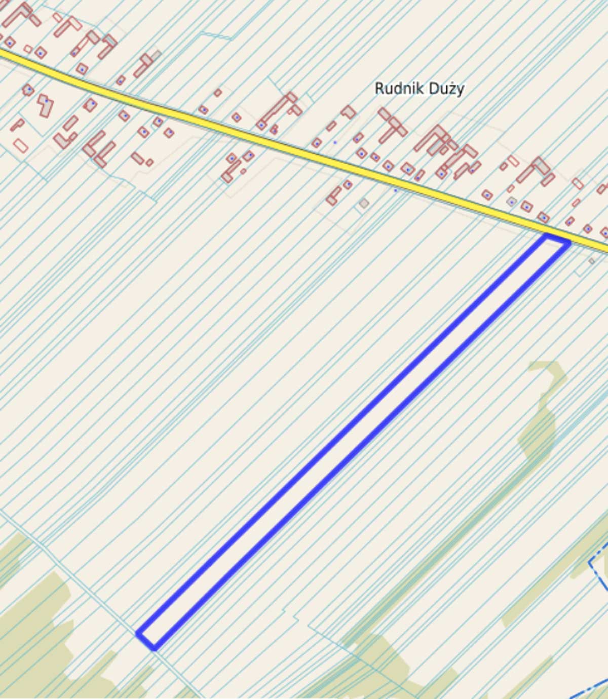 Mapa przedstawiająca obszar Rudnika Dużego, z wyraźnie zaznaczoną niebieską linią oraz siatką dróg i budynków.